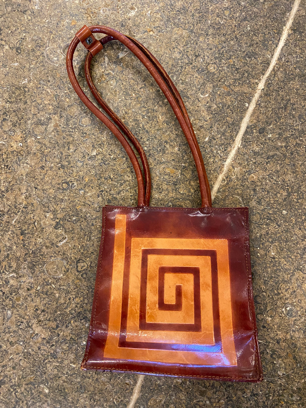 Brown leather swirl pattern shoulder bag