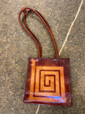 Brown leather swirl pattern shoulder bag